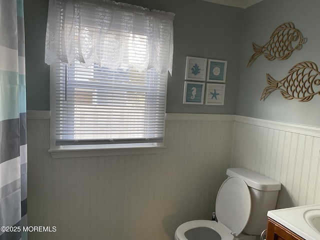 25 E 49th St, Long Beach Twp, NJ 08008 - full bath with a wainscoted wall, vanity, and curtained shower
