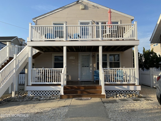 25 E 49th St, Long Beach Twp, NJ 08008 - view of front facade with covered porch and stairway