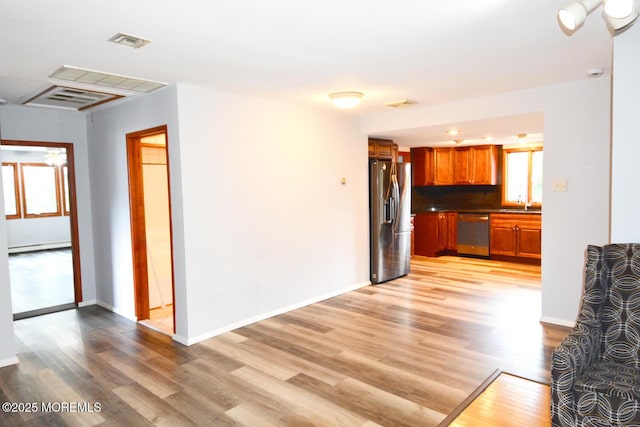 1111 River Ave, Point Pleasant, NJ 08742 - unfurnished living room with light wood-type flooring and a baseboard radiator