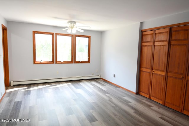 1111 River Ave, Point Pleasant, NJ 08742 - unfurnished bedroom with a baseboard radiator, wood finished floors, and a closet
