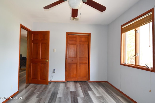 1111 River Ave, Point Pleasant, NJ 08742 - unfurnished bedroom featuring wood finished floors, ceiling fan, and a closet