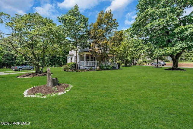 660 Herbertsville Rd, Brick, NJ 08724 - view of grassy yard featuring a porch