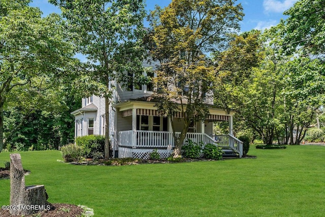 660 Herbertsville Rd, Brick, NJ 08724 - view of front facade featuring covered porch and a front yard