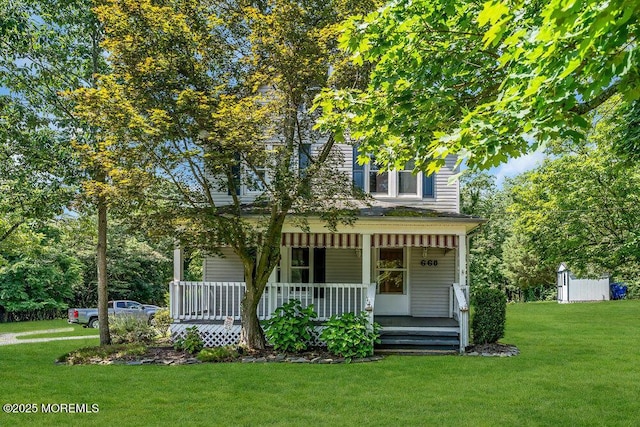 660 Herbertsville Rd, Brick, NJ 08724 - view of front of property with covered porch and a front lawn