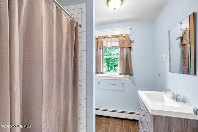 660 Herbertsville Rd, Brick, NJ 08724 - bathroom with a baseboard radiator, vanity, wood tiled floors, and a shower with shower curtain