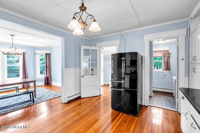 660 Herbertsville Rd, Brick, NJ 08724 - kitchen featuring a chandelier, freestanding refrigerator, a baseboard heating unit, light wood finished floors, and baseboard heating