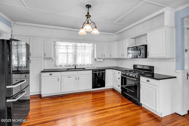 660 Herbertsville Rd, Brick, NJ 08724 - kitchen featuring black appliances, dark countertops, white cabinets, and crown molding