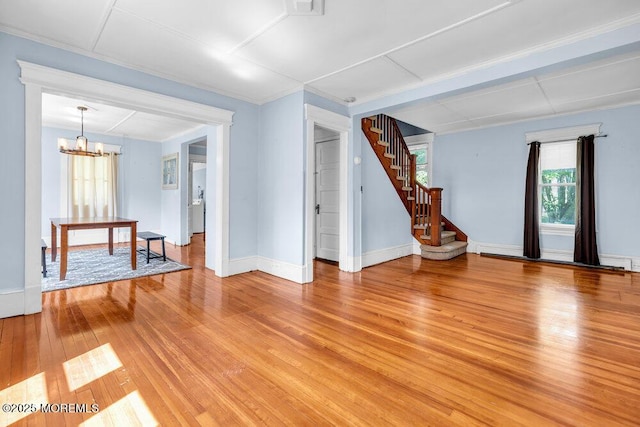 660 Herbertsville Rd, Brick, NJ 08724 - unfurnished living room with light wood-style floors, a chandelier, and stairway