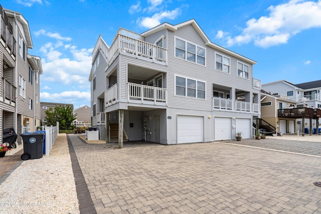 507 Amber St Unit B, Beach Haven, NJ 08008 - raised beach house featuring an attached garage, driveway, and a residential view