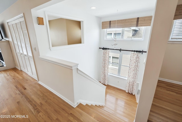 507 Amber St Unit B, Beach Haven, NJ 08008 - hall with wood finished floors, healthy amount of natural light, recessed lighting, and an upstairs landing