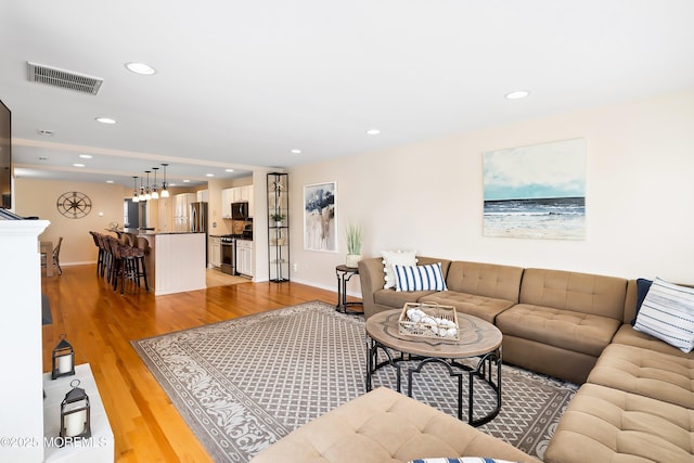 507 Amber St Unit B, Beach Haven, NJ 08008 - living room featuring light wood-type flooring and recessed lighting