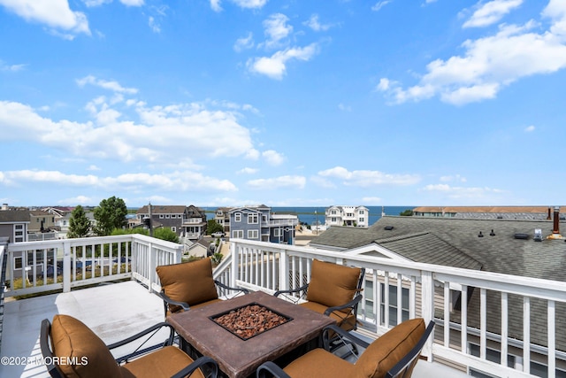 507 Amber St Unit B, Beach Haven, NJ 08008 - wooden terrace featuring an outdoor fire pit, a residential view, and a water view