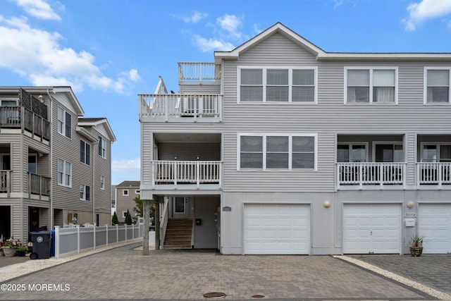 507 Amber St Unit B, Beach Haven, NJ 08008 - view of front of house featuring decorative driveway, a balcony, and a garage