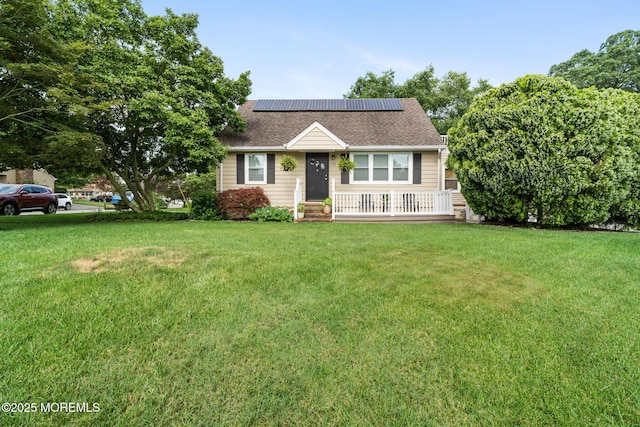 529 Smith Dr, Point Pleasant, NJ 08742 - view of front of home featuring solar panels, a front yard, and a shingled roof