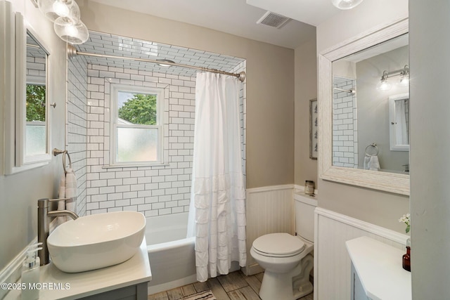 529 Smith Dr, Point Pleasant, NJ 08742 - bathroom with wainscoting, vanity, shower / bath combo, and wood finished floors