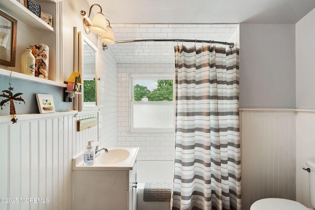 529 Smith Dr, Point Pleasant, NJ 08742 - full bath with vanity, shower / bathtub combination with curtain, and a wainscoted wall