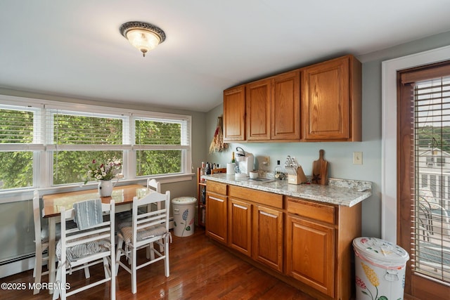 529 Smith Dr, Point Pleasant, NJ 08742 - kitchen featuring brown cabinets, dark wood-style flooring, and light stone countertops