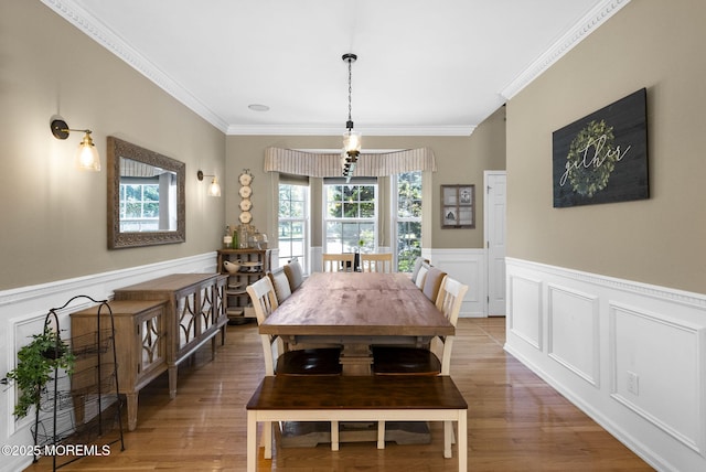 6 Tower Ct, Farmingdale, NJ 07727 - dining space with plenty of natural light, light wood-style floors, wainscoting, ornamental molding, and a decorative wall