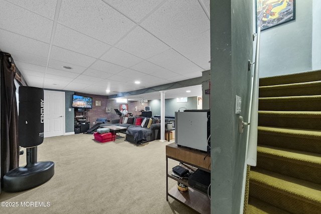 6 Tower Ct, Farmingdale, NJ 07727 - living area featuring carpet floors, a drop ceiling, and stairway