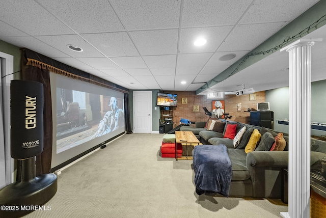 6 Tower Ct, Farmingdale, NJ 07727 - home theater room featuring carpet, a paneled ceiling, brick wall, decorative columns, and recessed lighting