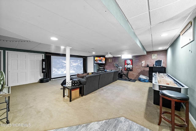 6 Tower Ct, Farmingdale, NJ 07727 - carpeted living room featuring brick wall, a drop ceiling, and recessed lighting