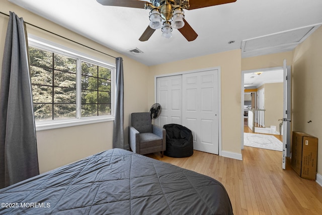 6 Tower Ct, Farmingdale, NJ 07727 - bedroom with light wood-style flooring, a closet, ceiling fan, and attic access
