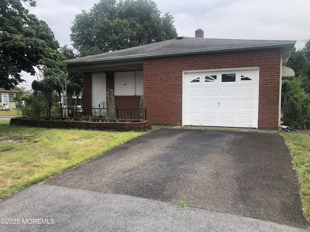 12 Tortola St, Toms River, NJ 08757 - view of front of home featuring brick siding, a garage, asphalt driveway, a chimney, and a shingled roof