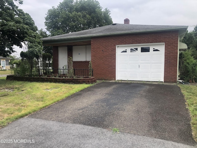 12 Tortola St, Toms River, NJ 08757 - view of front of home featuring brick siding, a garage, asphalt driveway, a chimney, and a shingled roof