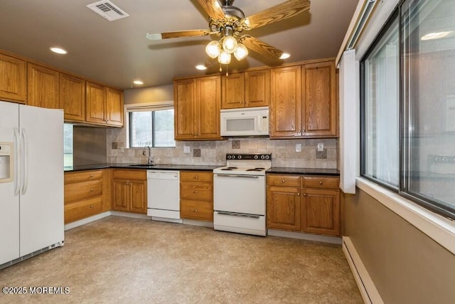 239 Medford Ct Unit B, Manalapan, NJ 07726 - kitchen with white appliances, brown cabinets, dark countertops, tasteful backsplash, and recessed lighting