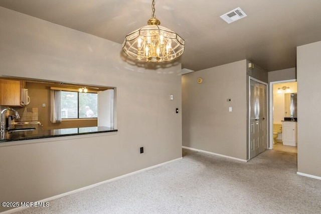 239 Medford Ct Unit B, Manalapan, NJ 07726 - unfurnished dining area with carpet floors and a chandelier