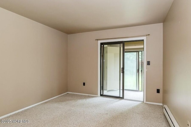 239 Medford Ct Unit B, Manalapan, NJ 07726 - empty room featuring a baseboard heating unit and light colored carpet