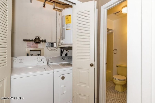 239 Medford Ct Unit B, Manalapan, NJ 07726 - laundry area featuring washer and dryer, water heater, and tile patterned flooring