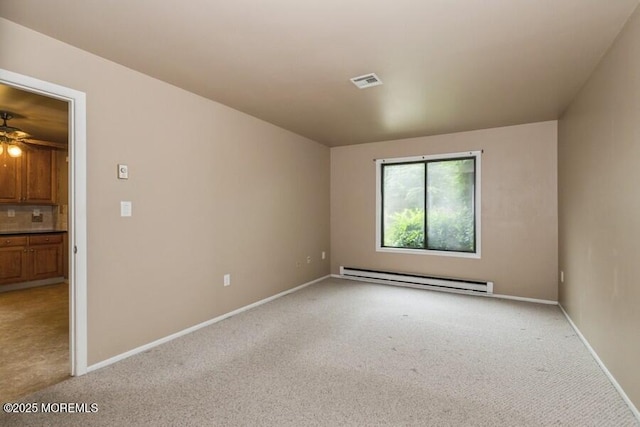 239 Medford Ct Unit B, Manalapan, NJ 07726 - spare room with a baseboard heating unit and light carpet