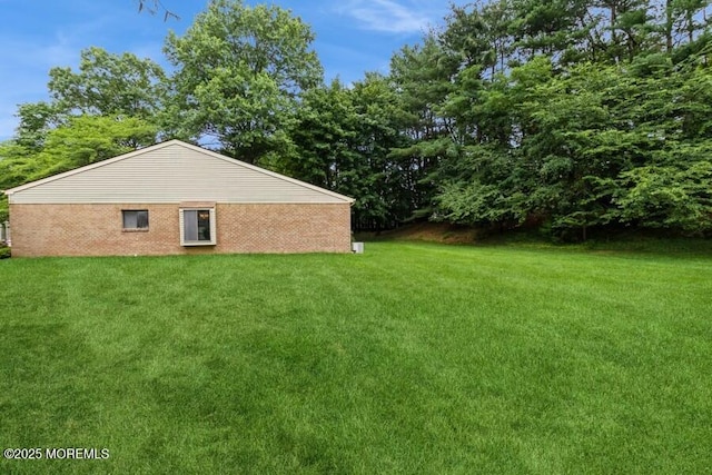 239 Medford Ct Unit B, Manalapan, NJ 07726 - view of home's exterior featuring a lawn