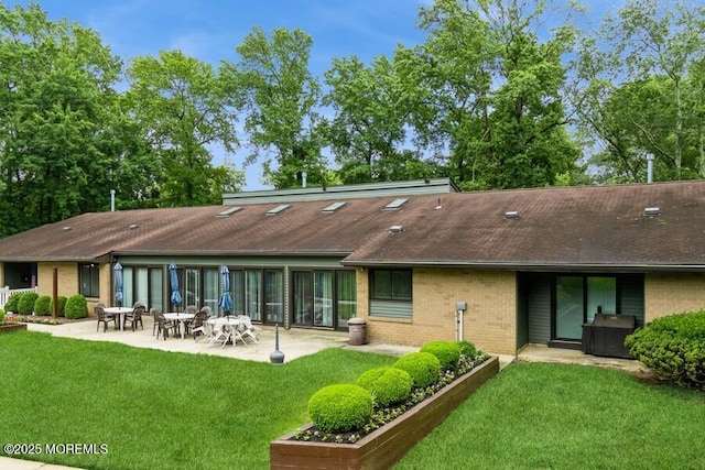 239 Medford Ct Unit B, Manalapan, NJ 07726 - rear view of property with a patio area, a yard, brick siding, and roof with shingles