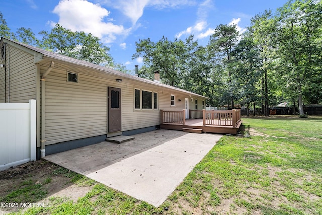 271 S Stump Tavern Rd, Jackson, NJ 08527 - rear view of house featuring a deck, a patio area, and a chimney
