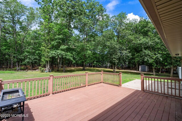 271 S Stump Tavern Rd, Jackson, NJ 08527 - wooden deck with a shed, a lawn, and view of wooded area