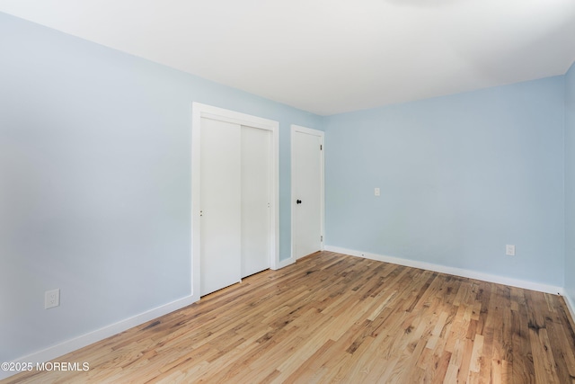 271 S Stump Tavern Rd, Jackson, NJ 08527 - unfurnished bedroom with wood finished floors and a closet