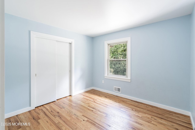 271 S Stump Tavern Rd, Jackson, NJ 08527 - unfurnished bedroom with light wood finished floors and a closet