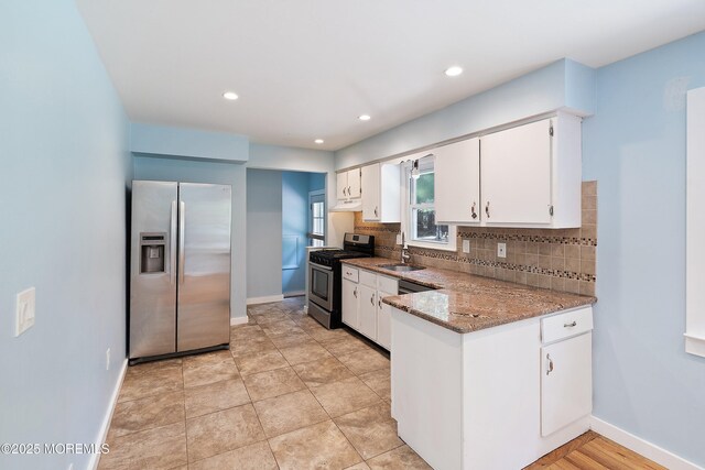 271 S Stump Tavern Rd, Jackson, NJ 08527 - kitchen featuring stainless steel appliances, tasteful backsplash, white cabinets, a peninsula, and light stone counters