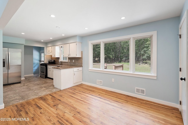 271 S Stump Tavern Rd, Jackson, NJ 08527 - kitchen with appliances with stainless steel finishes, white cabinetry, light wood-style floors, decorative backsplash, and recessed lighting