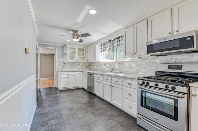 48 Washington Ave, Leonardo, NJ 07737 - kitchen with stainless steel appliances, a ceiling fan, white cabinetry, tasteful backsplash, and light countertops