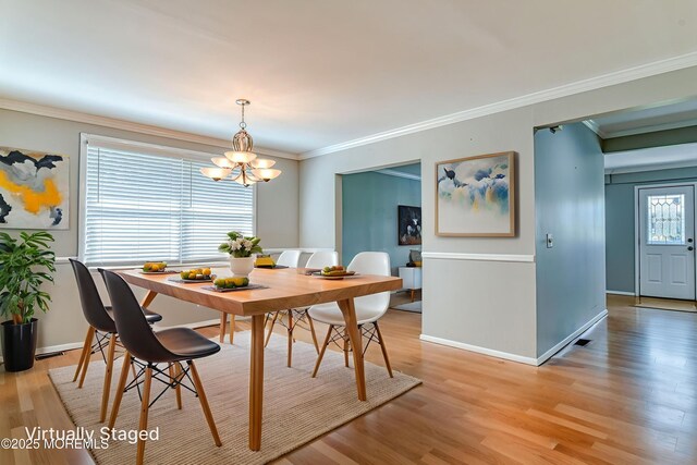 48 Washington Ave, Leonardo, NJ 07737 - dining area featuring a chandelier, light wood-type flooring, and ornamental molding