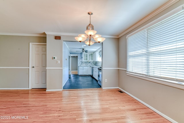 48 Washington Ave, Leonardo, NJ 07737 - unfurnished dining area featuring a chandelier, light wood-style flooring, crown molding, and ceiling fan