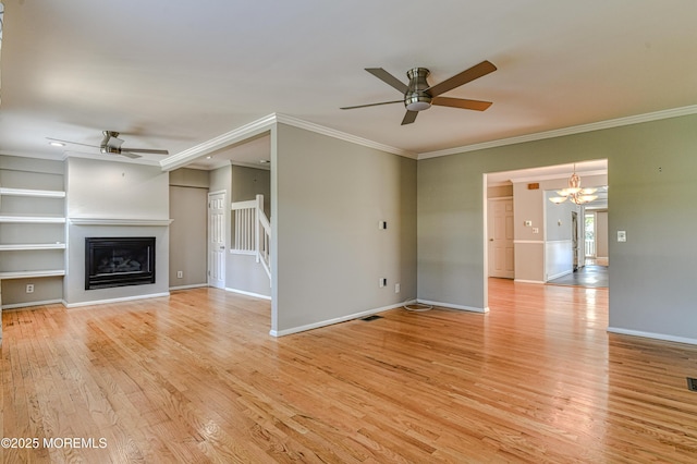 48 Washington Ave, Leonardo, NJ 07737 - unfurnished living room with ceiling fan, light wood-style floors, a chandelier, built in features, and crown molding