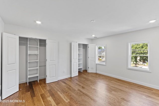 14 New Brunswick Ave, Matawan, NJ 07747 - unfurnished bedroom featuring multiple closets, wood finished floors, and recessed lighting