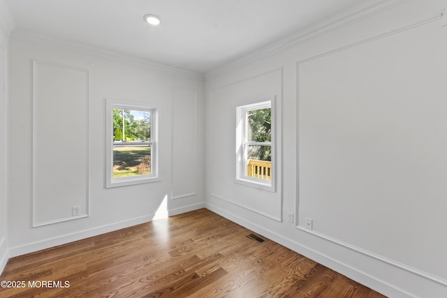 14 New Brunswick Ave, Matawan, NJ 07747 - empty room featuring ornamental molding, healthy amount of natural light, wood finished floors, and recessed lighting