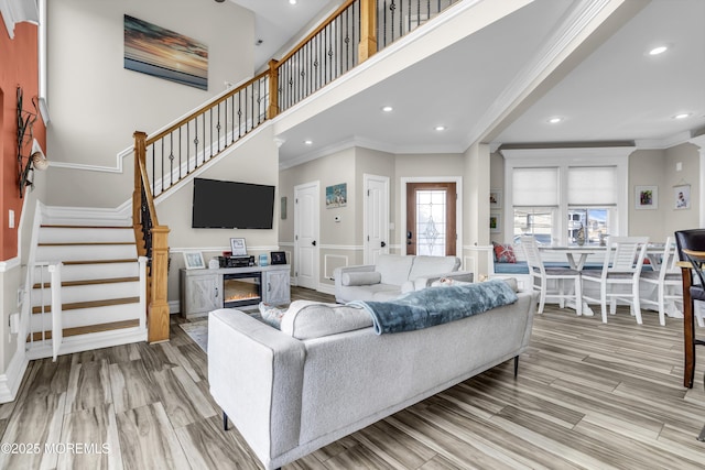 36 Joy Rd, Manahawkin, NJ 08050 - living area featuring ornamental molding, a decorative wall, wainscoting, stairway, and recessed lighting