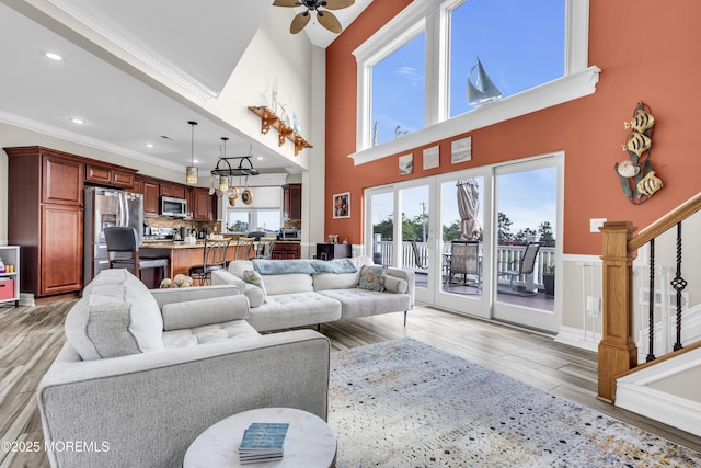 36 Joy Rd, Manahawkin, NJ 08050 - living area with stairway, light wood finished floors, a ceiling fan, crown molding, and recessed lighting
