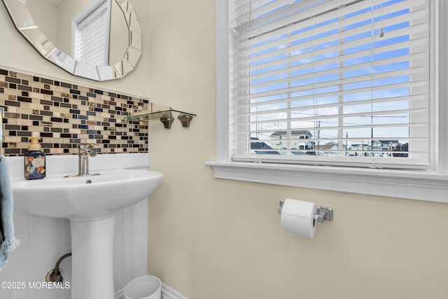 36 Joy Rd, Manahawkin, NJ 08050 - half bathroom featuring backsplash and a sink